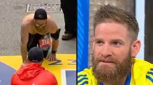 Marine who crawled across Boston Marathon finish line appears