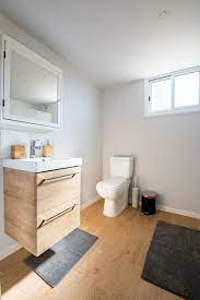 In the image below, you see a black and white basketweave design on the floor which works beautifully with the darker shower wall mosaics. Small Bathroom Flooring Ideas That Will Transform Your Space