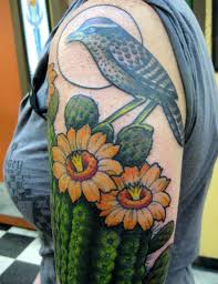 A huge cactus in the form of a tree, blooming in red flowers, grow in a residential area of the city of bodrum, turkey. Xina Xiii Few New Tattoos Cactus Tattoo Tattoos Blossom Tattoo