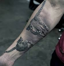 A simple tattoo can be artistic in its minimalism. 50 Cheetah Tattoos For Men Big Spotted Cat Design Ideas