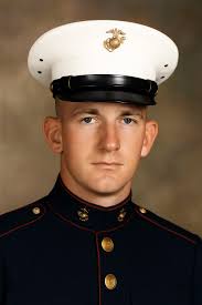 A Navy Corpsman identified as D.R. Howe, administers aid to wounded Marine  Private First Class D.A. Crum during the Battle of Hue City in February of  1968. Howe and Crum were serving