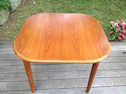 This modern beauty is available in a number of hardwoods and six expanding top sizes. Self Storing Butterfly Leaf Danish Style Dining Table Teak Mid Century Modern Dining Table Danish Style Table