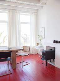8 Ways To Bring Red Into Your Space Bloesem Red Floor Painted Wood Floors Painted Wooden Floors