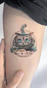 Cheshire Cat Tattoo On The Arm Www Otziapp Com Tattoos Tattoos For Women Small Tattoo Designs For Women