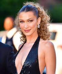 Electric red and orange pieces at the front of her mane. Bella Hadid Dyes Her Hair Beachy Blonde For Summer
