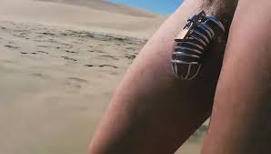 Public beach exposure in chastity - ThisVid.com