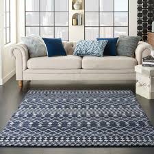 Lighter floors help stop the room from feeling closed in, and lighter grey furnishings are the perfect contrast to the rich blue walls. Dakota Fields Moritz Southwestern Navy Blue Gray Area Rug Reviews Wayfair