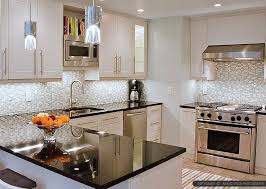 Here's the ultimate black kitchen ideas gallery and article showcasing kitchens with black cabinets, countertops, appliances, backsplashes and more. 50 Black Countertop Backsplash Ideas Tile Designs Tips Advice Outdoor Kitchen Countertops Kitchen Countertops Black Granite Countertops
