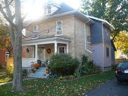 addition to a yellow brick home two tone wood with cedar edging brick house outdoor structures architecture