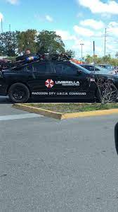 In a world where you can be anythi oval car magnet. Probably The Most Intense Umbrella Corp Car Ive Seen With Working Fake Gatling Guns On The Sides Umbrella Resident Evil Collection Umbrella Corporation