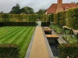 Trees are planted in lines, the branches are woven together to strengthen and fill any weak spots until the hedge thickens. Planting Advice For Pleached Trees Hedgeworx
