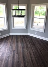 The average cost of engineered hardwood flooring is about $8 per square foot, although pricing may be higher or lower depending on the flooring selected. Distressed Luxury Vinyl Plank Flooring In Walkout Basement Lvp Modern Rustic New Ho Living Room Wood Floor Luxury Vinyl Plank Flooring Luxury Vinyl Plank