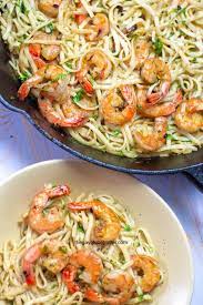 A creamy white wine sauce, al dente fettuccine noodles, parmesan cheese, and simple sautéed shrimp make a its light yet so satisfying. The Best Shrimp Scampi With Linguine The Gay Globetrotter