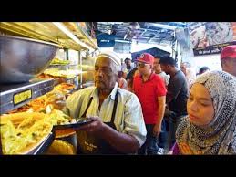 Popularised by tamil muslim traders from india, this aromatic dish is a plateful of rice, fried chicken, an assortment of curries, vegetables and telur dadar. Line Clear Nasi Kandar Penang Best In The World Youtube