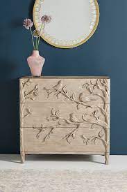Hand carved furniture will always have slight imperfections. Handcarved Ornithology Three Drawer Dresser Anthropologie