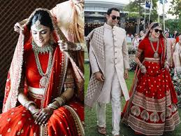 The couple have used black umbrellas to hide. This Bride S Red Lehenga Will Remind You Of Deepika Padukone S Wedding Outfit Times Of India