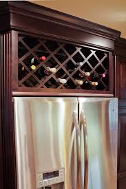 Gallery Red River Remodelers Wine Rack Built In Above Refirgerator Dark Expresso Cabinets Kitchen Cabinet Wine Rack Wine Rack Design Built In Wine Rack