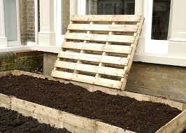 Once you've secured a sizable pile, it's time to put them to use. Making Free Raised Beds From A Palette It S Easy Ish Out Of My Shed