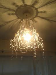My Homemade Chandelier Using Strings Of Pearls Crystals And An Old Lampshade Frame Fixed Together With My Lamp Shade Frame Diy Lamp Shade Homemade Chandelier