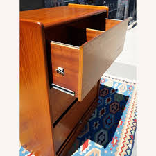 Large double sided filing cabinet with vertical tambour doors. Danish Teak Tambour Lateral Filing Cabinet Aptdeco