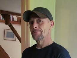 Hungry man tries to separate frozen burgers