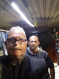 Who is the man in the door of Loaves & Fishes?