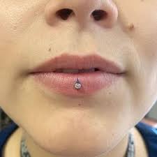 Ashley Piercing 50 Ideas And Complete Guide Rightpiercing Ashley Piercing Facial Piercings Labret Piercing Ring