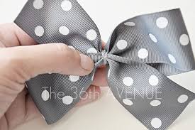 Wrap the top bunny ear behind and poke through the loop at the bottom. How To Make A Perfect Bow The 36th Avenue