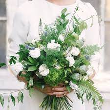 Classic white peony and rose bouquet accented by greenery. 16 Pretty Greenery Bridal Bouquets