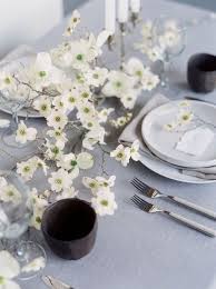 Modern bohemian table numbers and flower arrangements. 40 Spring Centerpieces For Any Kind Of Tablescape Digsdigs