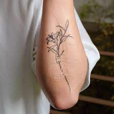 It`s used by women for increasing their sexuality, innocence, so, lily flower tattoo idea is the women tattoo trend. Fine Line Lily And Rose Tattoo On Forearm