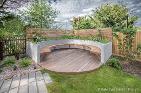 A Curved Bench And Circular Deck In A Garden Design In Turney Road Dulwich Back Garden Design Garden Seating Garden Design