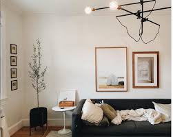 What seems as simple as hammering a nail and hanging a frame is know the right height. How High To Hang Pictures Answered Framebridge