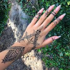 Or a male model preparing for a calvin. Tribal Henna