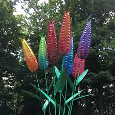 These tall metal flowers make the perfect addition to any garden, pathway, patio, planter, or outdoor living area. Metal Flower Garden Decor Metal Sculpture Set Of 7 Etsy Metal Flowers Metal Flowers Garden Metal Garden Art