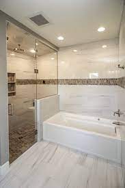 It is a room where people groom for hygiene and do other necessary activities. Marble Tiled Bathroom Flooring And Walls With Brown Tiled Accents Brown Tile Bathroom Marble Tile Bathroom Marble Tile Bathroom Shower