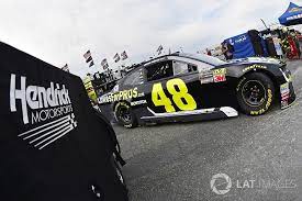 Nascar cup series driver martin truex jr (right) stands next to his car in the garage during practice for the gander outdoors 400 at dover at dover international speedway. Is Jimmie Johnson S Dover Finish An Ominous Sign For Chevy