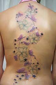 Flower Star And Butterfly Tattoo Designs Favorite Girl Tattoos Of All Time Butterfly Back Tattoo Butterfly Tattoo Designs Flower Tattoo Back