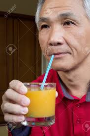 Please subscribe get me to 50 🙏🏽🙏🏽🙏🏽🙏🏽🙏🏽 A Chinese Middle Aged Man Who Drinking Orange Juice Stock Photo Picture And Royalty Free Image Image 17053206