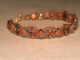 Silky Stacker From Deborah Roberti Around The Beading Table Silky Beads In Jet Capri Gol With Images Beaded Jewelry Beaded Bracelets Beaded Bracelet Patterns