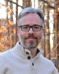 What if one were to add weight to Pinewood Derby wheels to store energy and  help