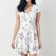 Try a knit dress that perfectly combines comfort and style. Hollister Dresses Hollister White Floral Side Tie Faux Wrap Dress Poshmark