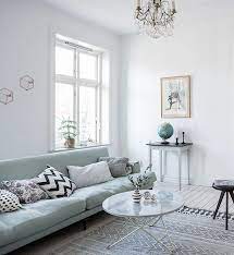 But mint's real beauty is that it can easily be paired with other colors and patterns. Mint Green Sofa In A Light Home Coco Lapine Design Green Living Room Decor Green Couch Living Room Green Sofa Living Room