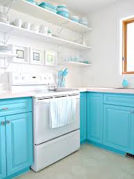 A muted green cabinet color adds depth and interest to the kitchen, while a butler sink and butcher block countertop adds a level of country chic. A Budget Friendly Kitchen Makeover With Turquoise Cabinets Open Shelving Dans Le Lakehouse