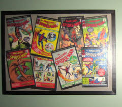 Put Already Read Comics Into Large Frames Ikea Use Pins So They Can Be Removed And Read Again Later Comic Book Display Geek Room Amazing Spiderman