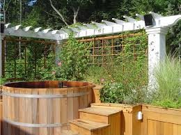 Chic Trellises In Exterior Traditional With Cape Cod Style House Next To Front Entrance Alongside Front Step Hot Tub Garden Hot Tub Landscaping Hot Tub Outdoor
