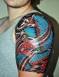 The koi fish is a very strong symbol with extremely deep meaning for those who choose it as part of their body art. Amazing Blue Koi Fish Tattoo On Man Left Shoulder