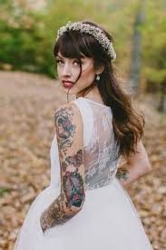 10 Gorgeous Tattooed Brides Who Refused To Cover Up Their Ink Brides With Tattoos Wedding Tattoos Bride