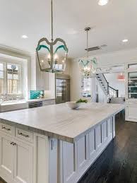 White And Teal Contemporary Kitchen Is Illuminated By Gray And Teal Lanterns Hun White Macaubas Quartzite Kitchen White Macaubas Quartzite Contemporary Kitchen
