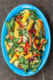 In a wok or frying pan, heat oil, add garlic and fry until golden. Mediterranean Style Mango Salad W Spinach L The Mediterranean Dish